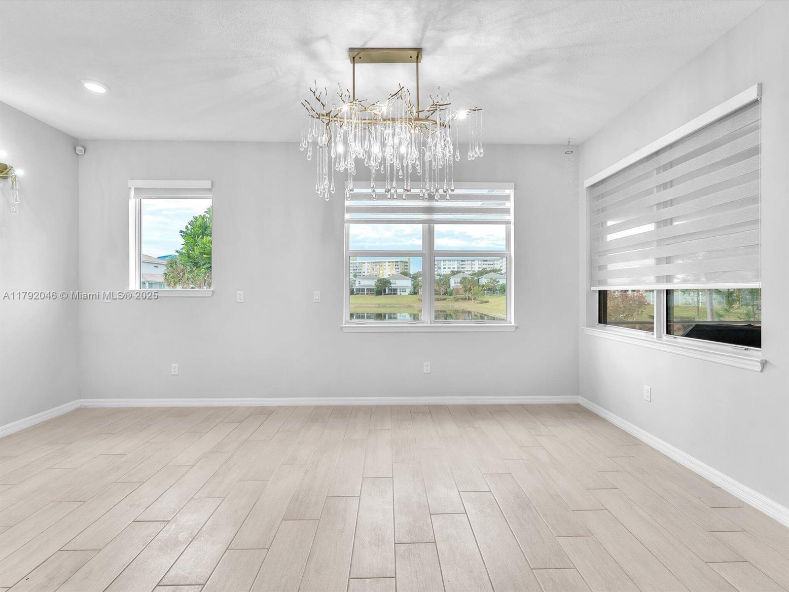 4317 Ficus Street Hollywood, FL 33021 - Photo 4 of 29 en empty room with windows