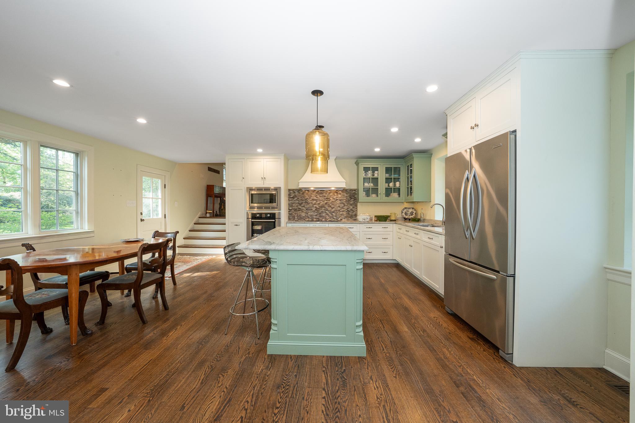 510 Lynmere Road Bryn Mawr, PA 19010 - Photo 13 of 44 an open kitchen with wooden floor and stainless steel appliances