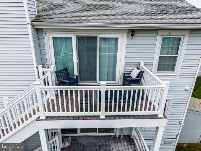 167 40th Street South Brigantine, NJ 08203 - Photo 22 of 28 a view of a chair and table in the balcony