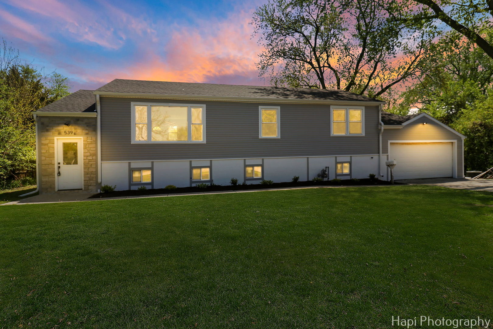 539 South Plum Grove Road Palatine, IL 60067 - Photo 2 of 33 a house view with a garden space