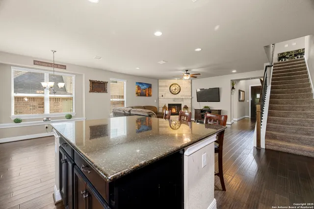 a bedroom with a large bed and a flat screen tv