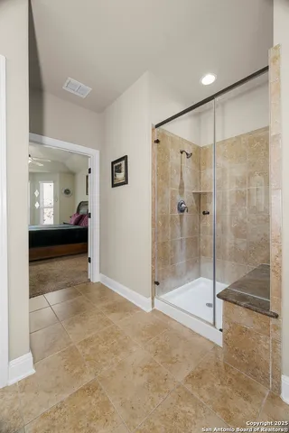 a bedroom that has a bed and a table in it