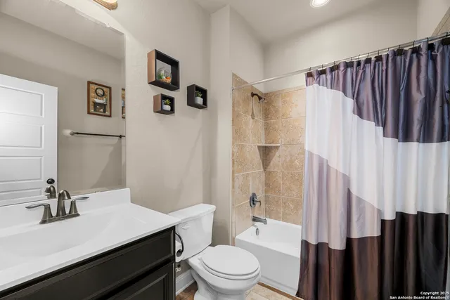 a spacious bedroom with bed and a window