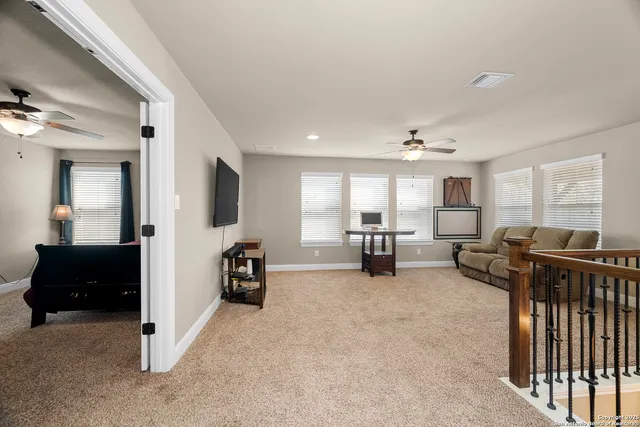 a room with a dresser and a mirror