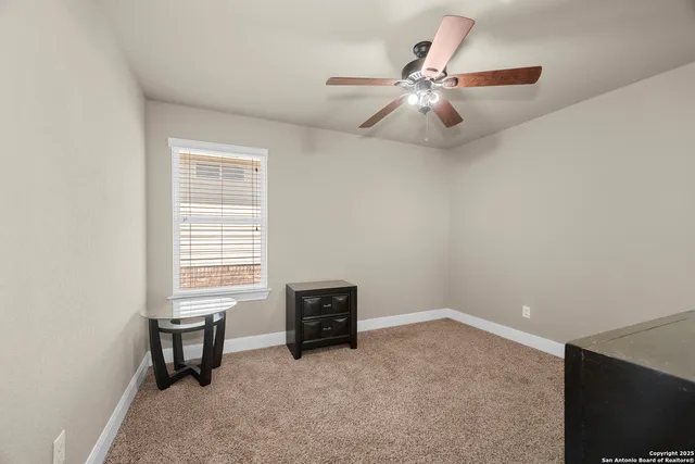 a view of a livingroom with a flat screen tv and furniture