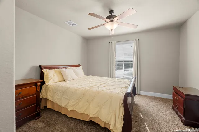 a backyard of a house with barbeque oven fire pit table and chairs
