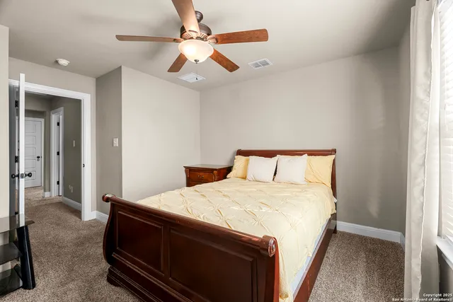 a view of a backyard with large trees