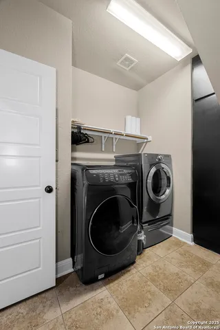 a bathroom with a toilet sink and a mirror