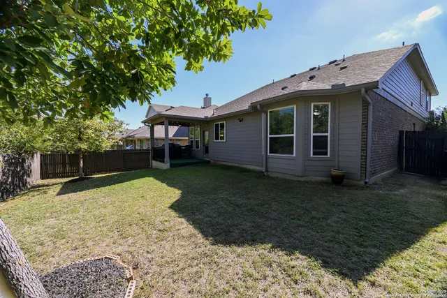 an aerial view of a house with a lake view
