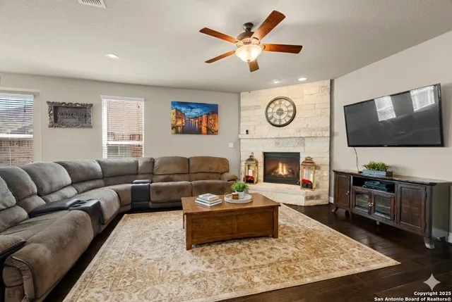 a view of a livingroom with furniture and a fireplace