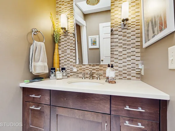 a bathroom with a sink and a mirror