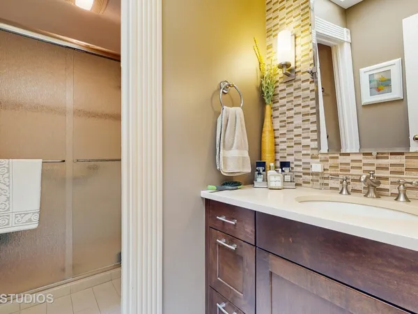a bathroom with a sink and a mirror