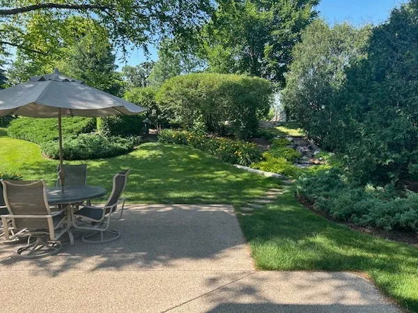 a view of a backyard with sitting area