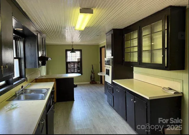 a large bathroom with a large tub and sink