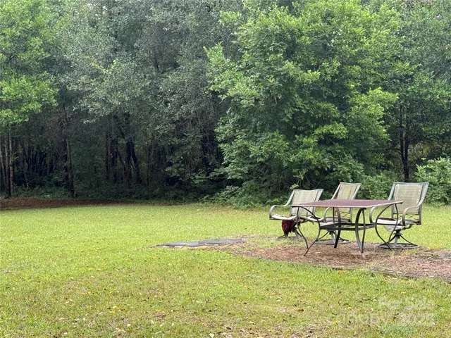 a lawn chairs sitting in a yard