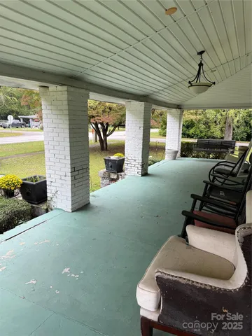 a room with furniture and a large window