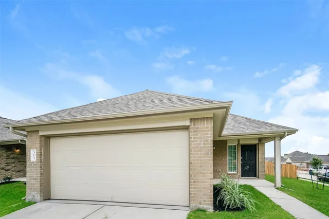 a view of a backyard with wooden fence