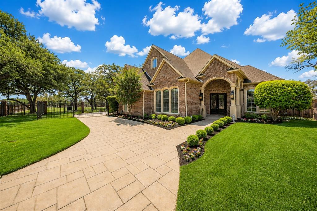 2726 Country Club Road Pantego, TX 76013 - Photo 1 of 23 a front view of house with yard and green space
