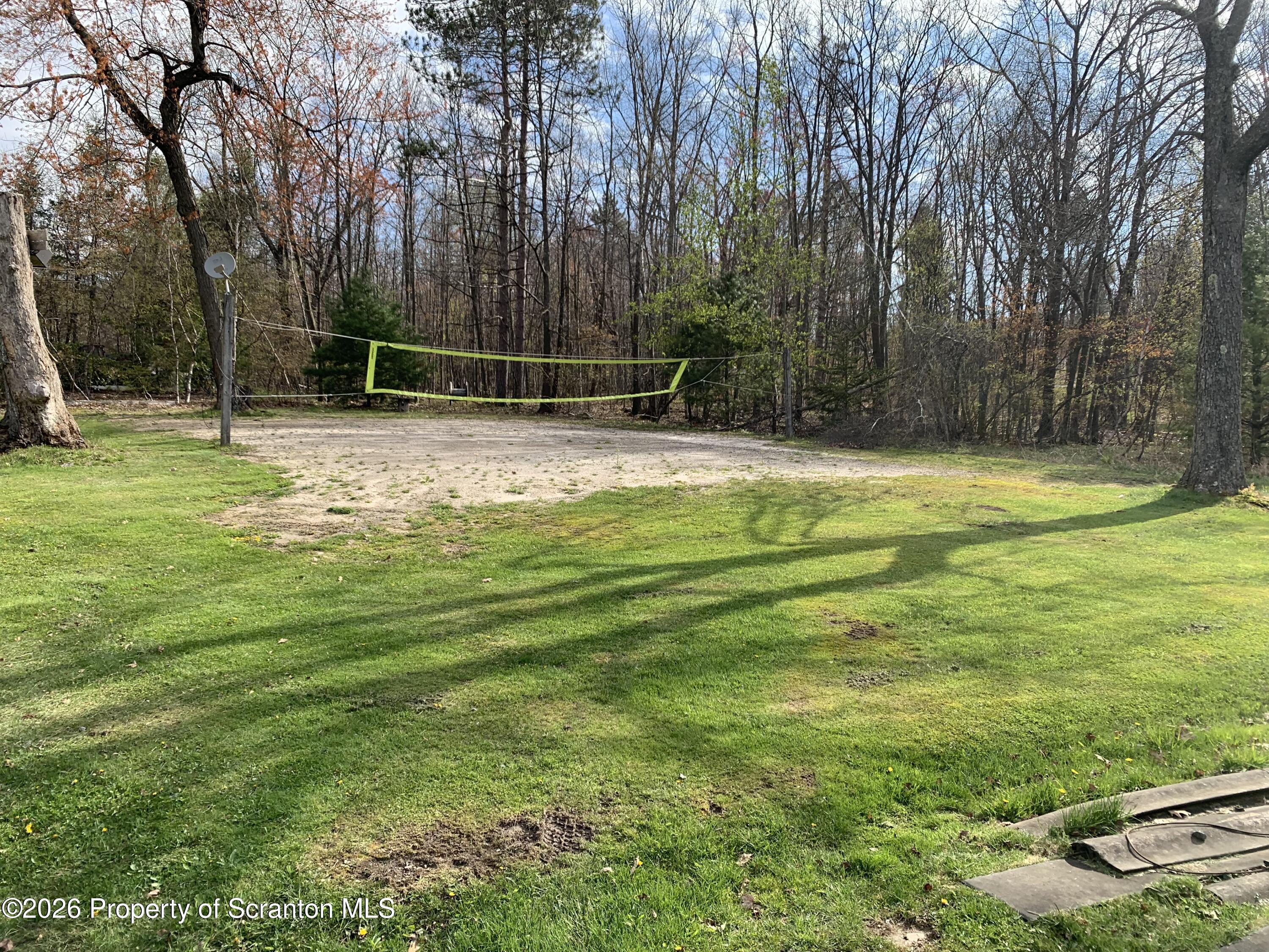 Glen Road Lake Ariel, PA 18436 - Photo 6 of 9 a view of a swimming pool with a yard and trees