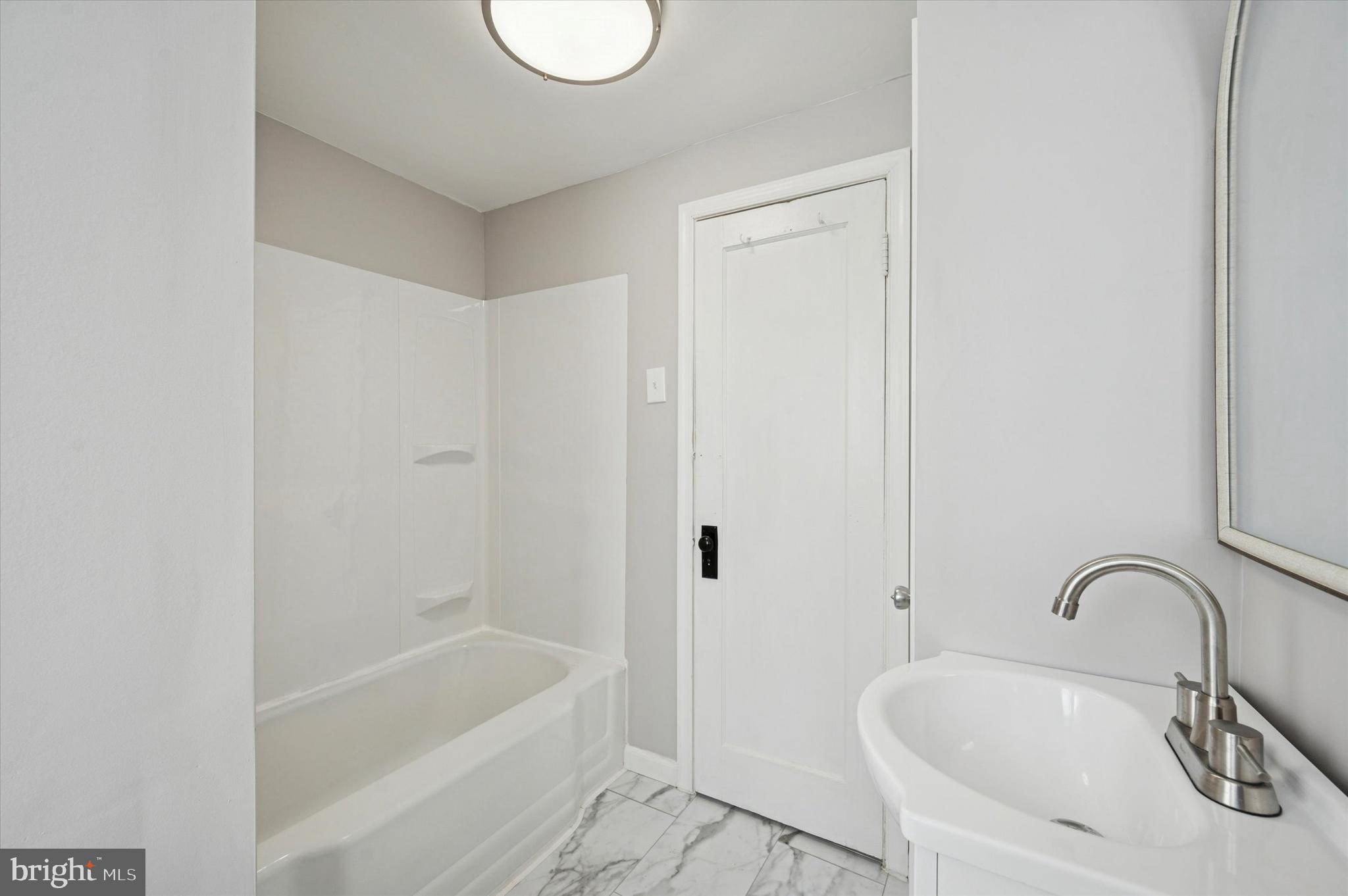 1114 Townsend Street Chester, PA 19013 - Photo 11 of 19 New tub enclosure, sink & toilet