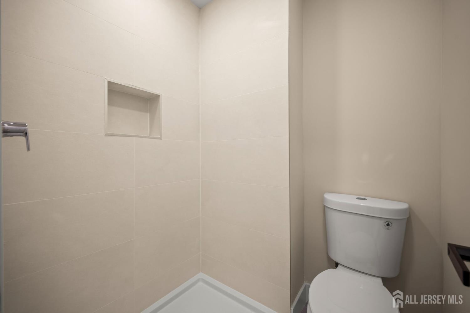 701 Croydon Road, Unit A Monroe Township, NJ 08831 - Photo 27 of 34 a white toilet sitting next to a white wall