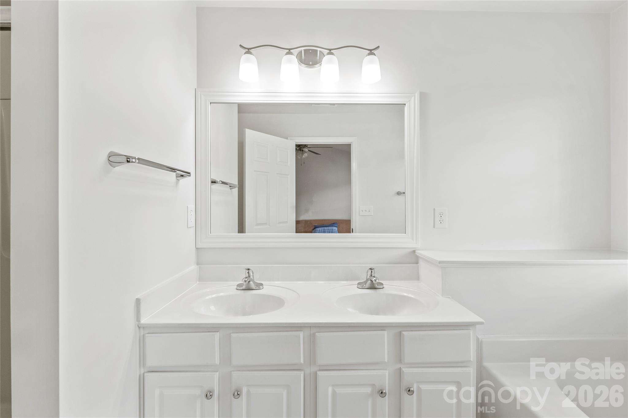 1707 Kashmir White Lane Fort Mill, SC 29708 - Photo 22 of 33 a bathroom with a sink and a mirror