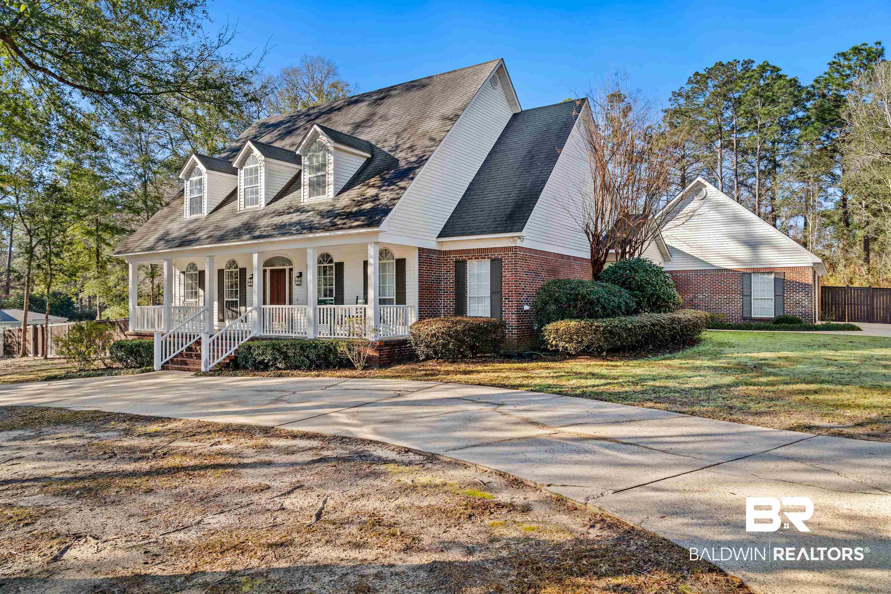 31267 Blakeley Ridge Court Spanish Fort, AL 36527 - Photo 41 of 61 View of front facade featuring covered porch, a front yard, fence, and brick siding