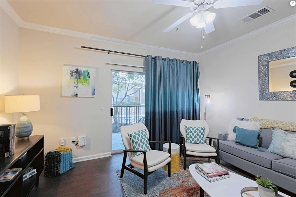 10505 I-35 Frontage Road South, Unit 827 Austin, TX 78747 - Photo 14 of 17 a living room with furniture and wooden floor