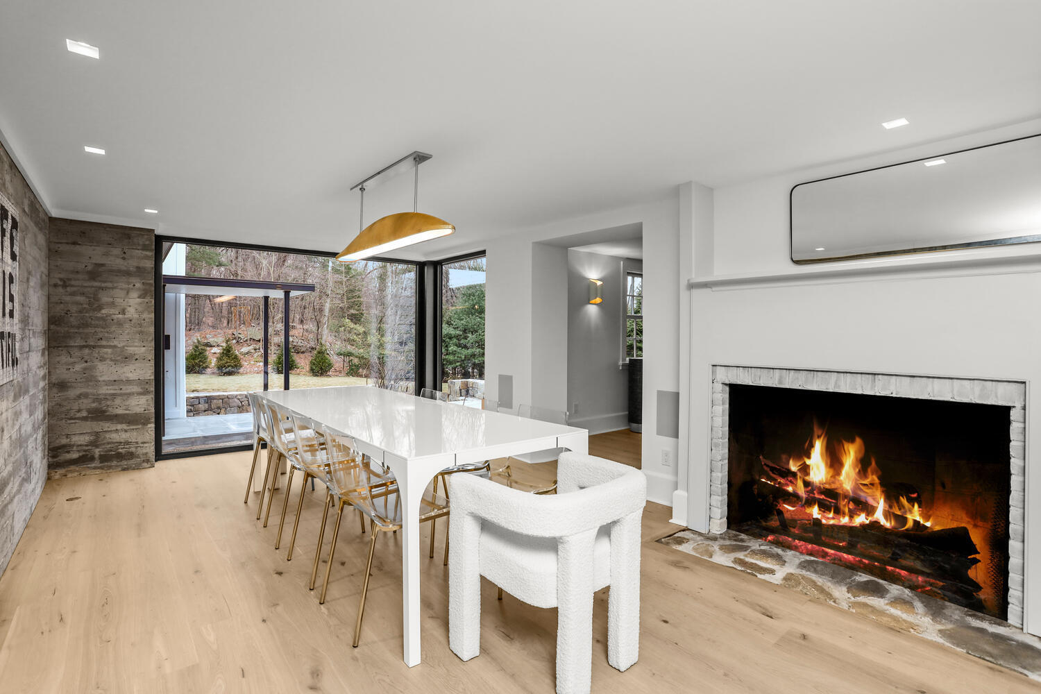 38 Goodwives River Road Darien, CT 06820 - Photo 20 of 58 a dining room with furniture a fireplace and a chandelier