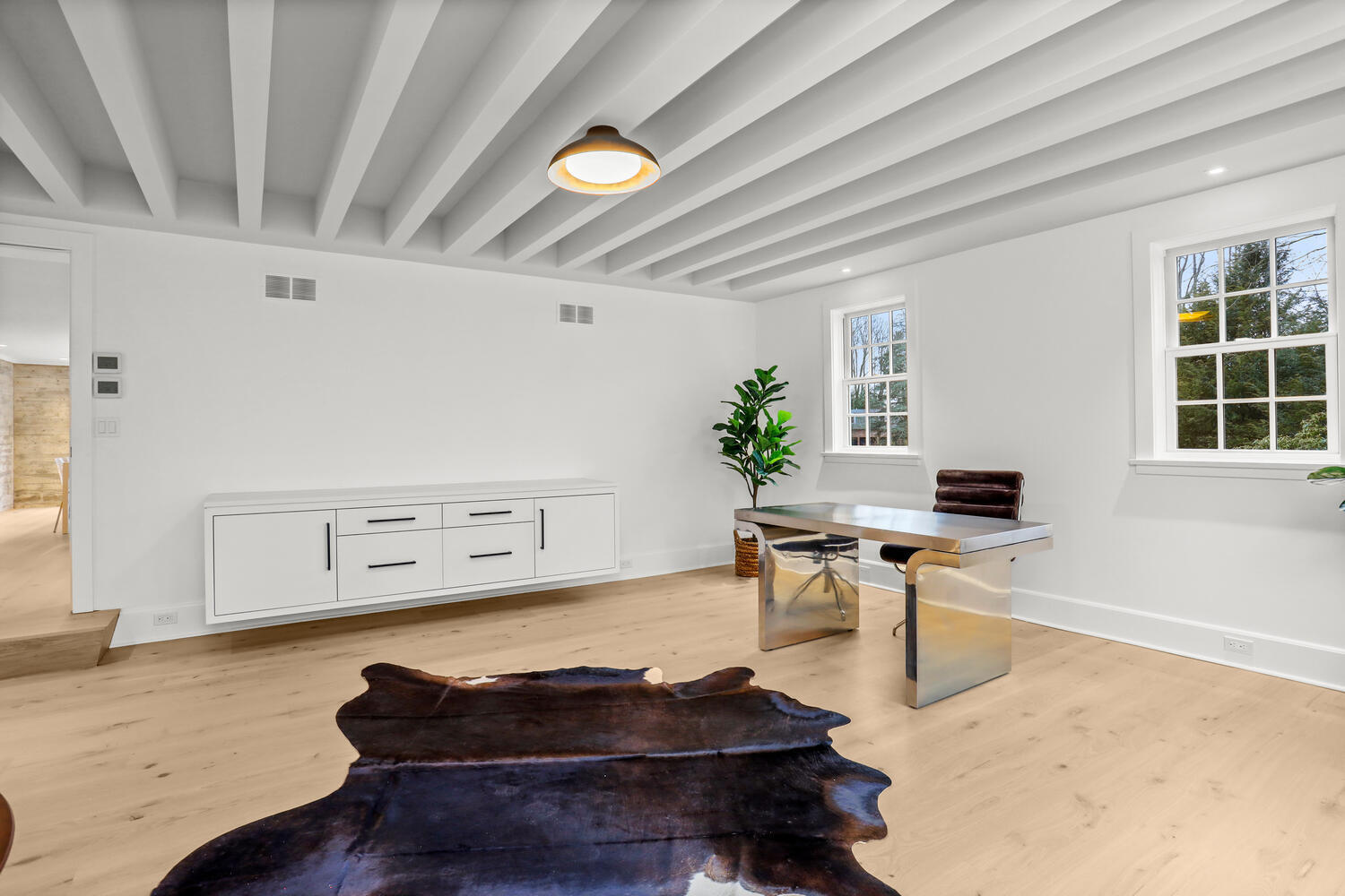 38 Goodwives River Road Darien, CT 06820 - Photo 25 of 58 a living room with furniture and a wooden floor