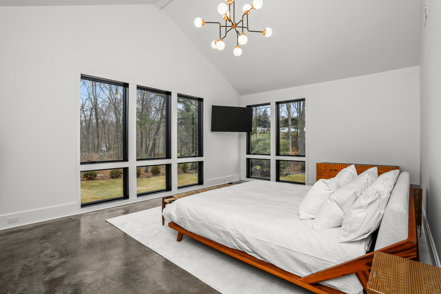 38 Goodwives River Road Darien, CT 06820 - Photo 27 of 58 a bedroom with a bed and large window