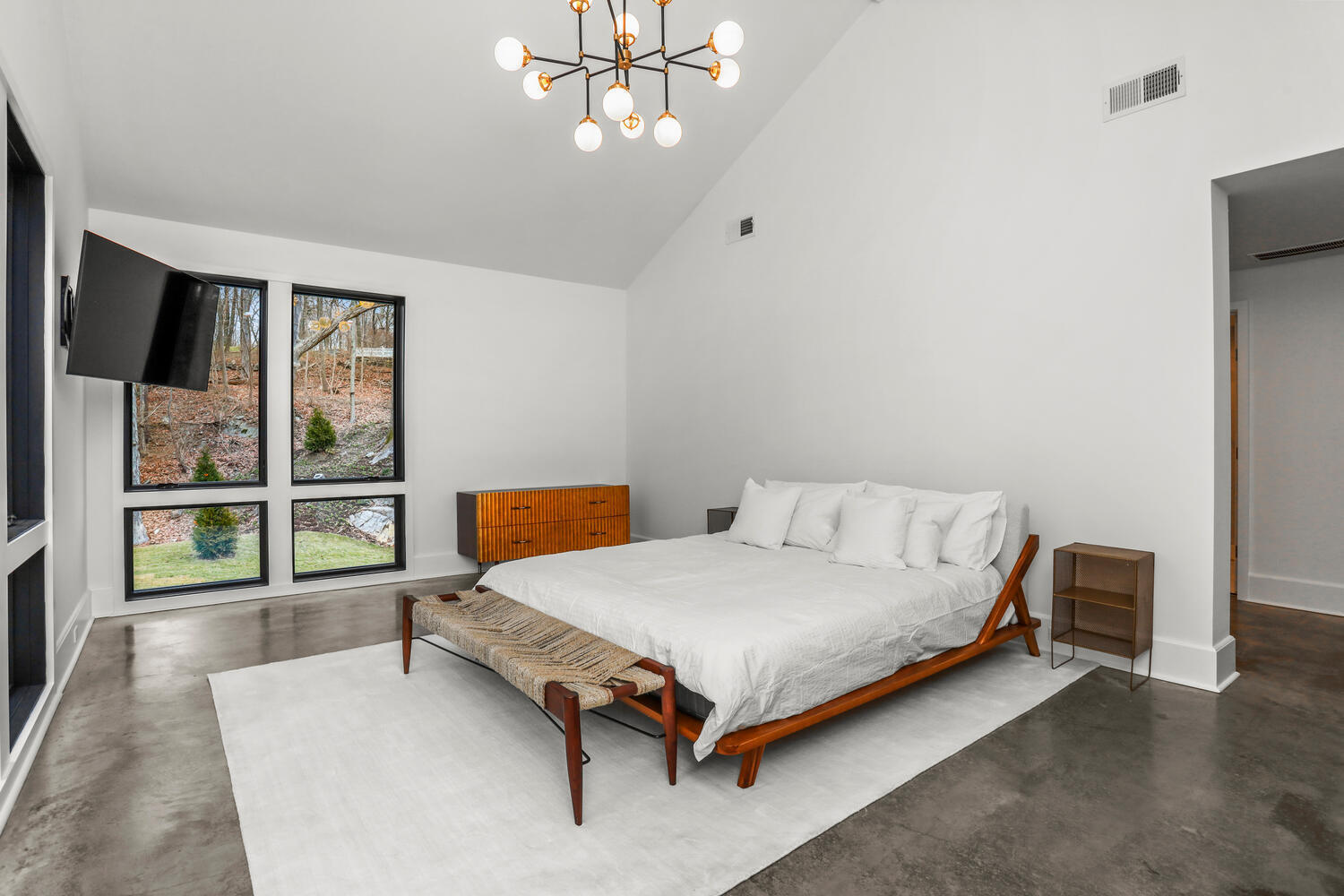 38 Goodwives River Road Darien, CT 06820 - Photo 28 of 58 a bedroom with a bed and a large window with outer view