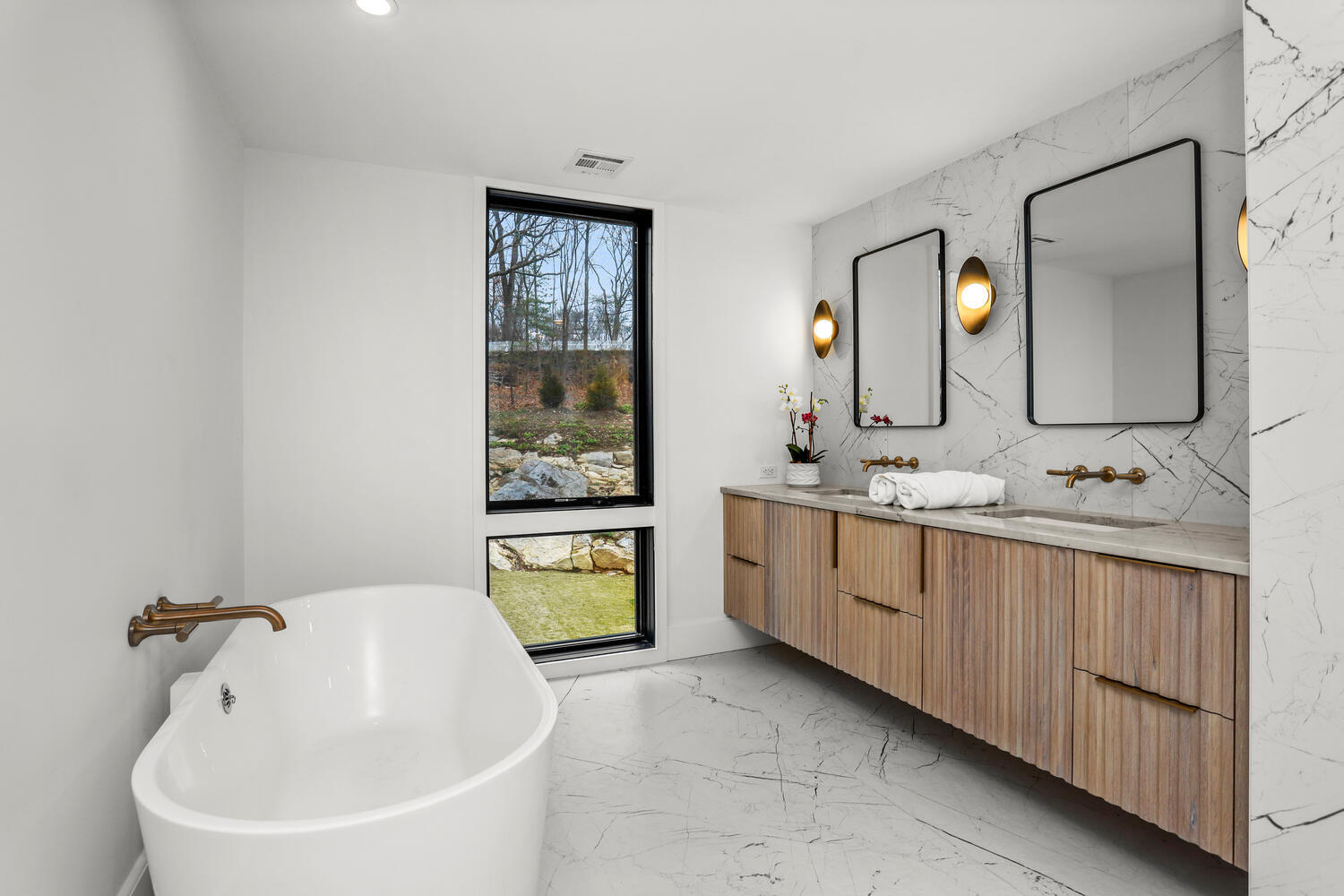 38 Goodwives River Road Darien, CT 06820 - Photo 31 of 58 a spacious bathroom with 2 sink tub and a mirror