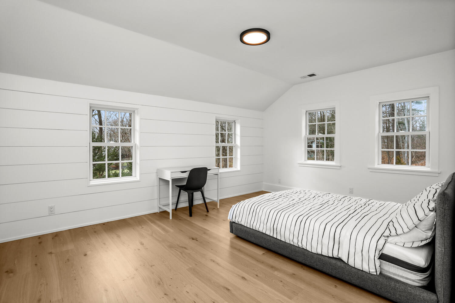 38 Goodwives River Road Darien, CT 06820 - Photo 36 of 58 a bedroom with a bed and a large window