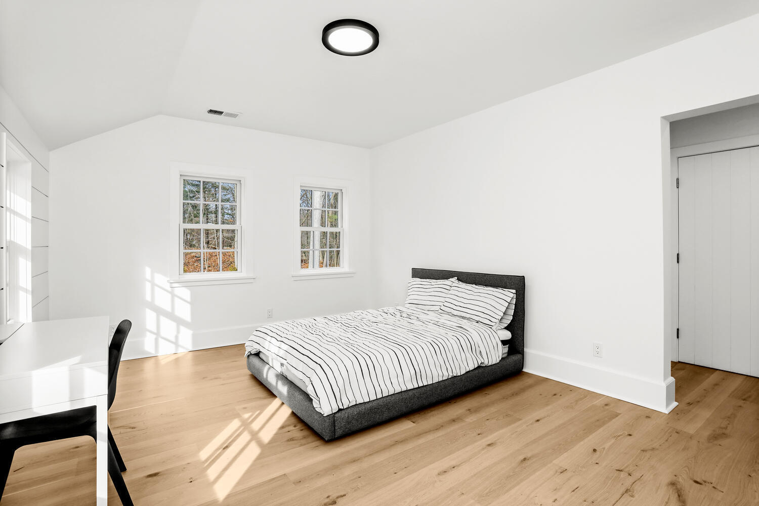 38 Goodwives River Road Darien, CT 06820 - Photo 37 of 58 a bedroom with a bed and wooden floor