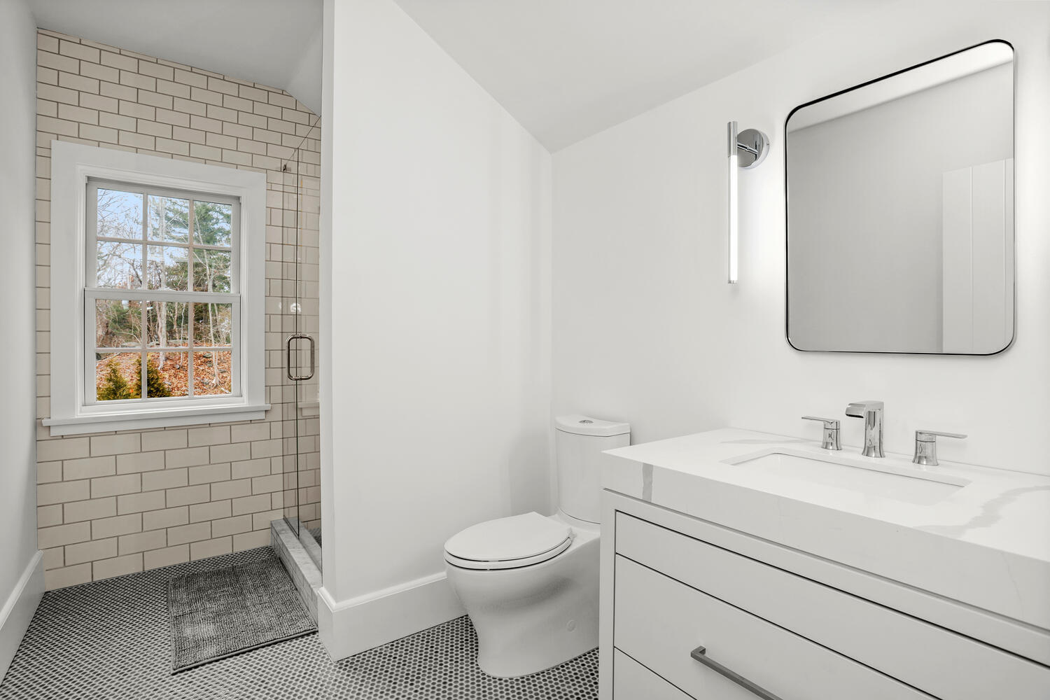 38 Goodwives River Road Darien, CT 06820 - Photo 38 of 58 a bathroom with a toilet a sink a mirror and a window