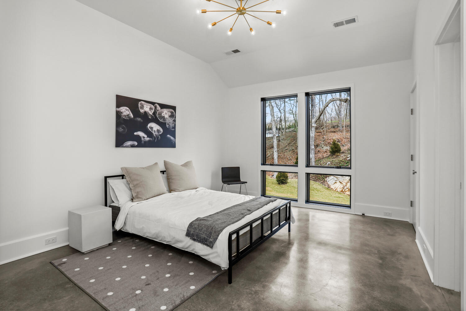38 Goodwives River Road Darien, CT 06820 - Photo 39 of 58 a spacious bedroom with a bed and a large window