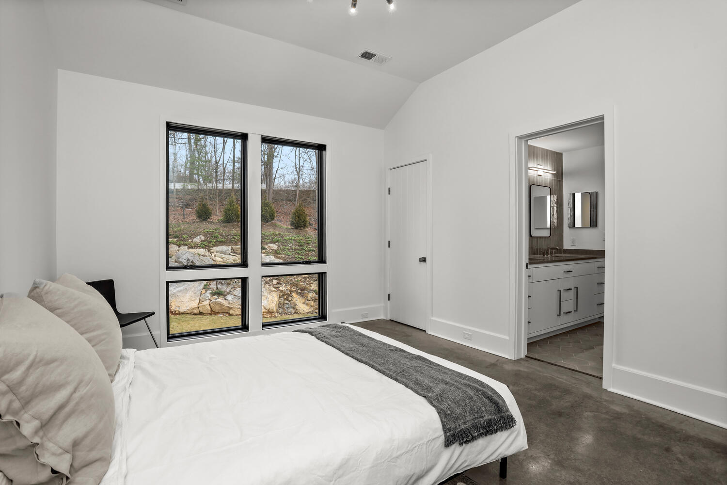 38 Goodwives River Road Darien, CT 06820 - Photo 40 of 58 a bedroom with a bed and a large window