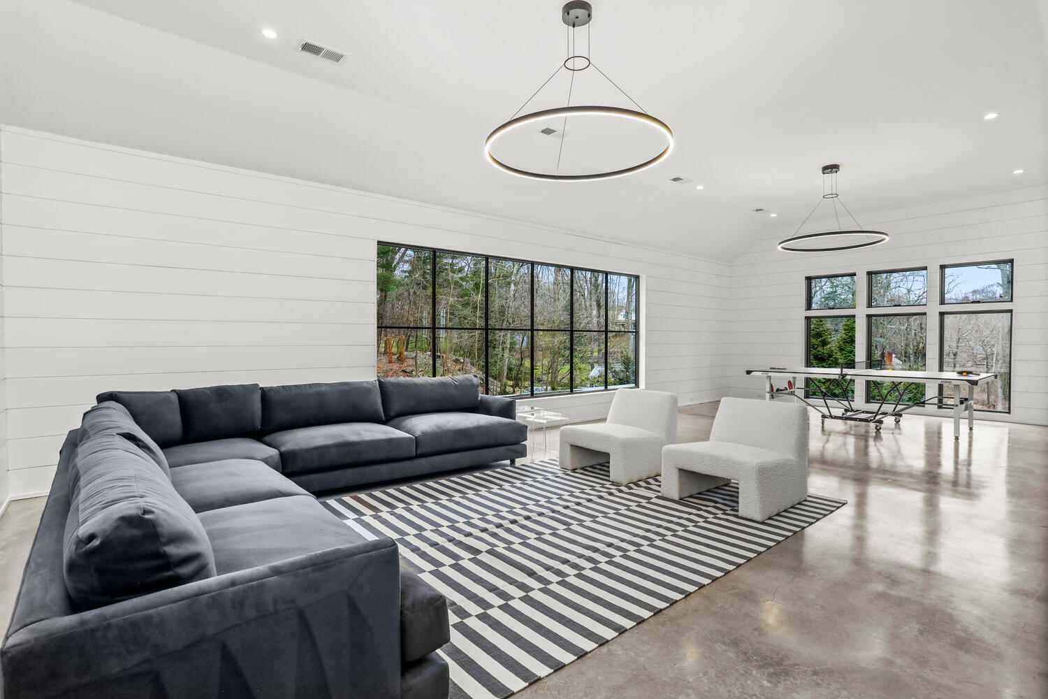 38 Goodwives River Road Darien, CT 06820 - Photo 46 of 58 a living room with furniture and a large window