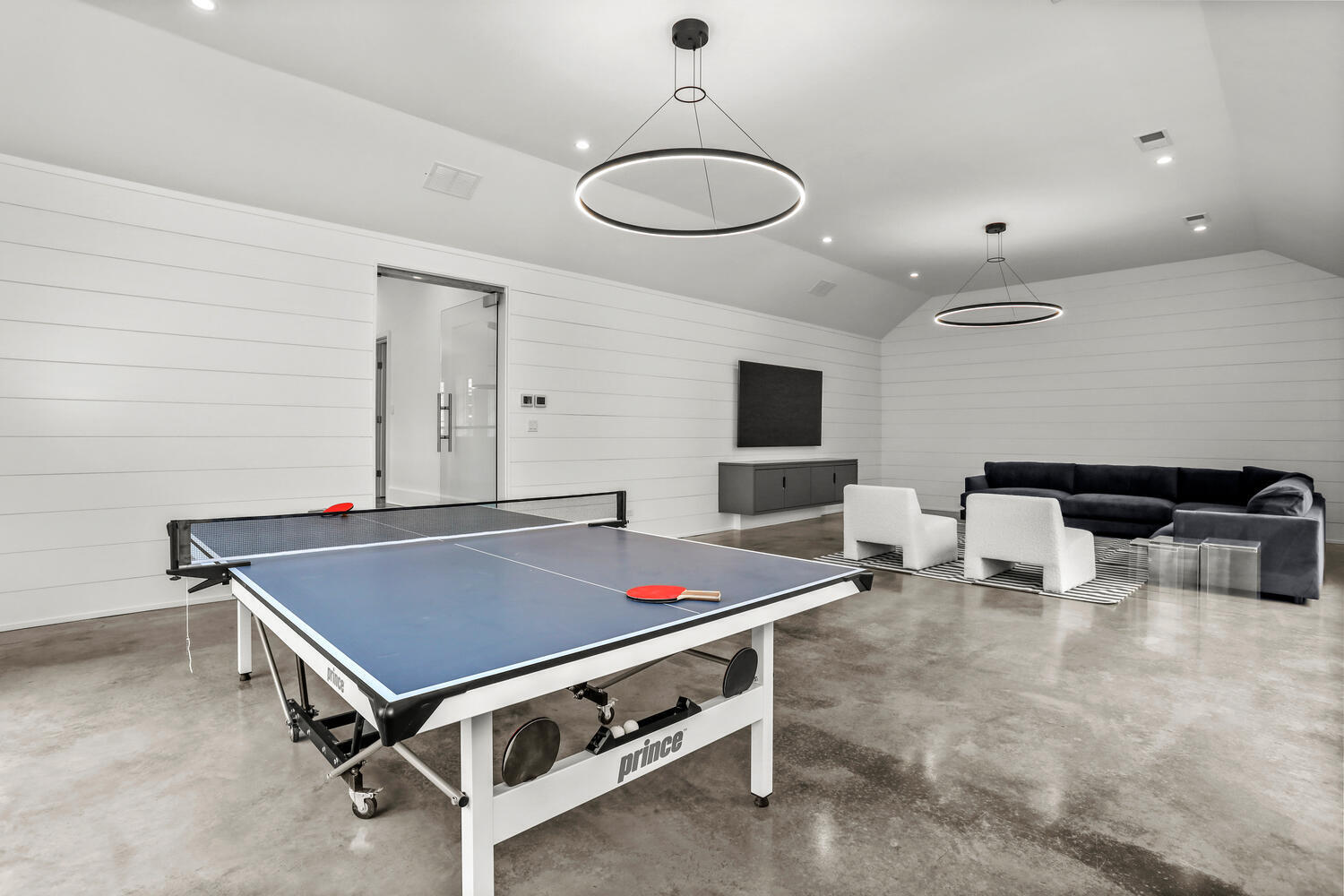 38 Goodwives River Road Darien, CT 06820 - Photo 47 of 58 a living room with furniture pool table and a fireplace