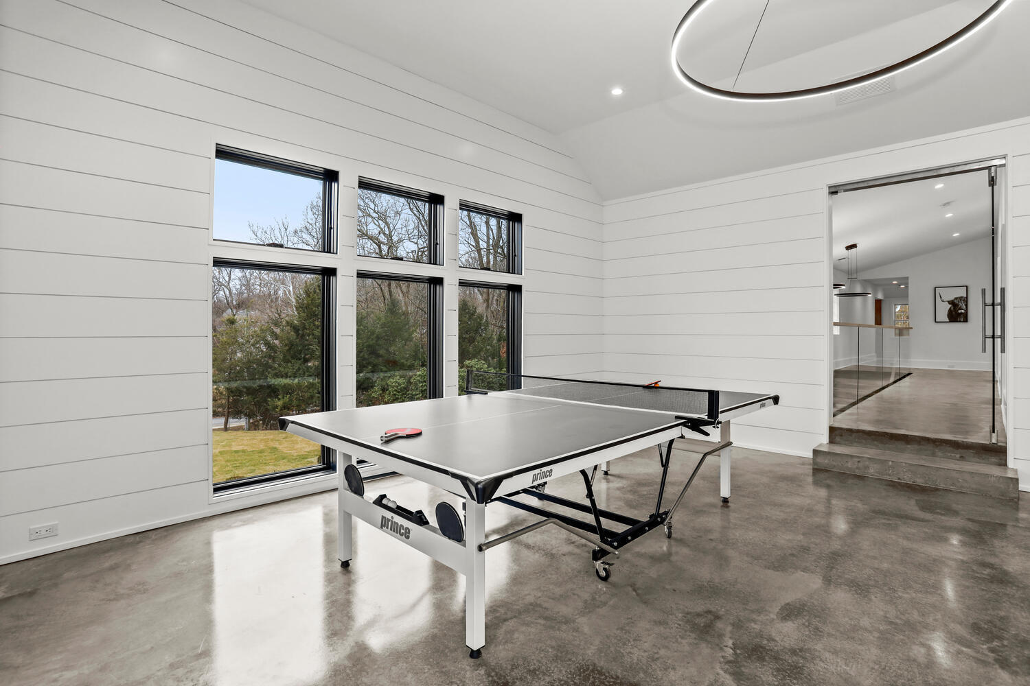 38 Goodwives River Road Darien, CT 06820 - Photo 48 of 58 a room with table chairs and windows