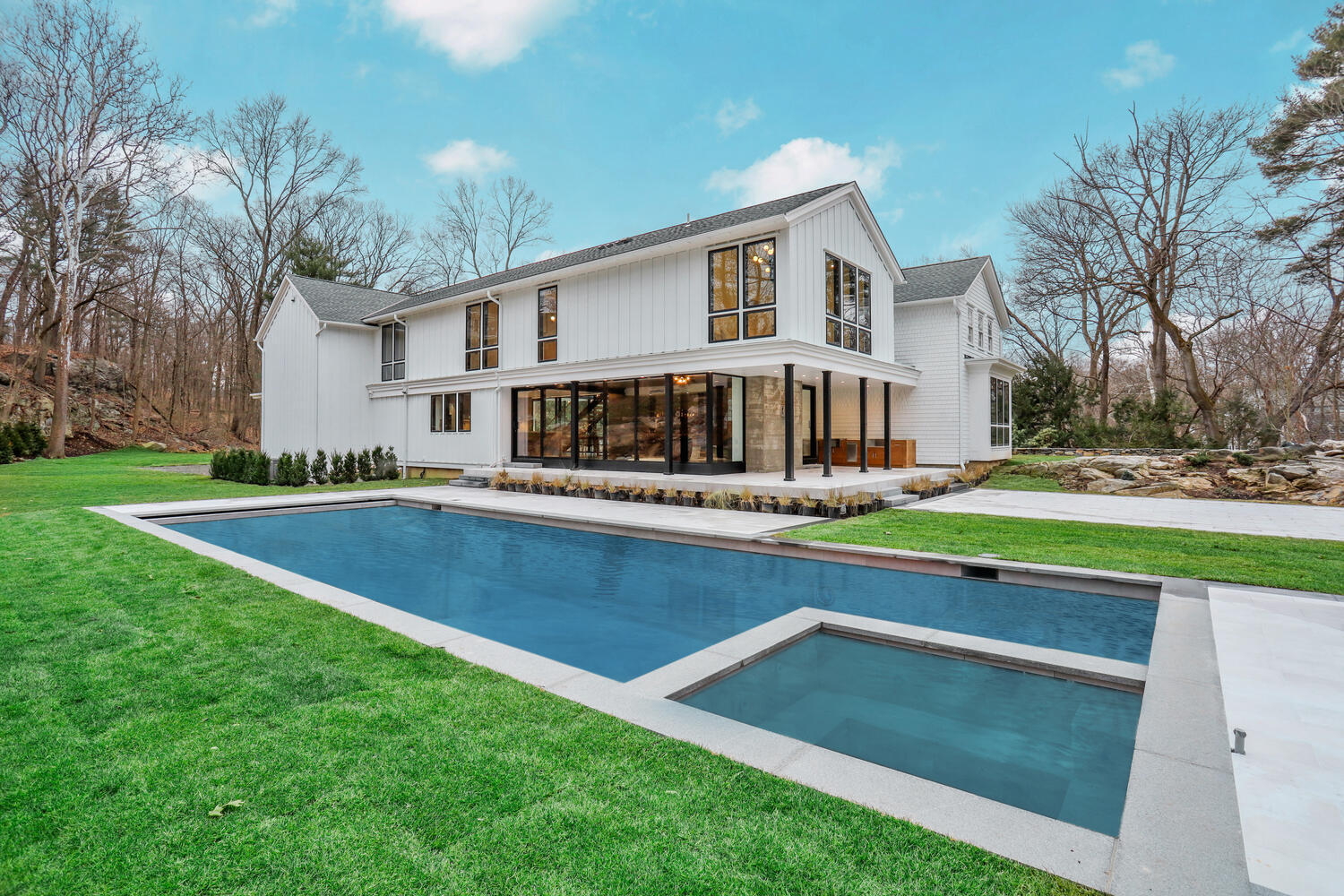 38 Goodwives River Road Darien, CT 06820 - Photo 51 of 58 a front view of a house with swimming pool having outdoor seating