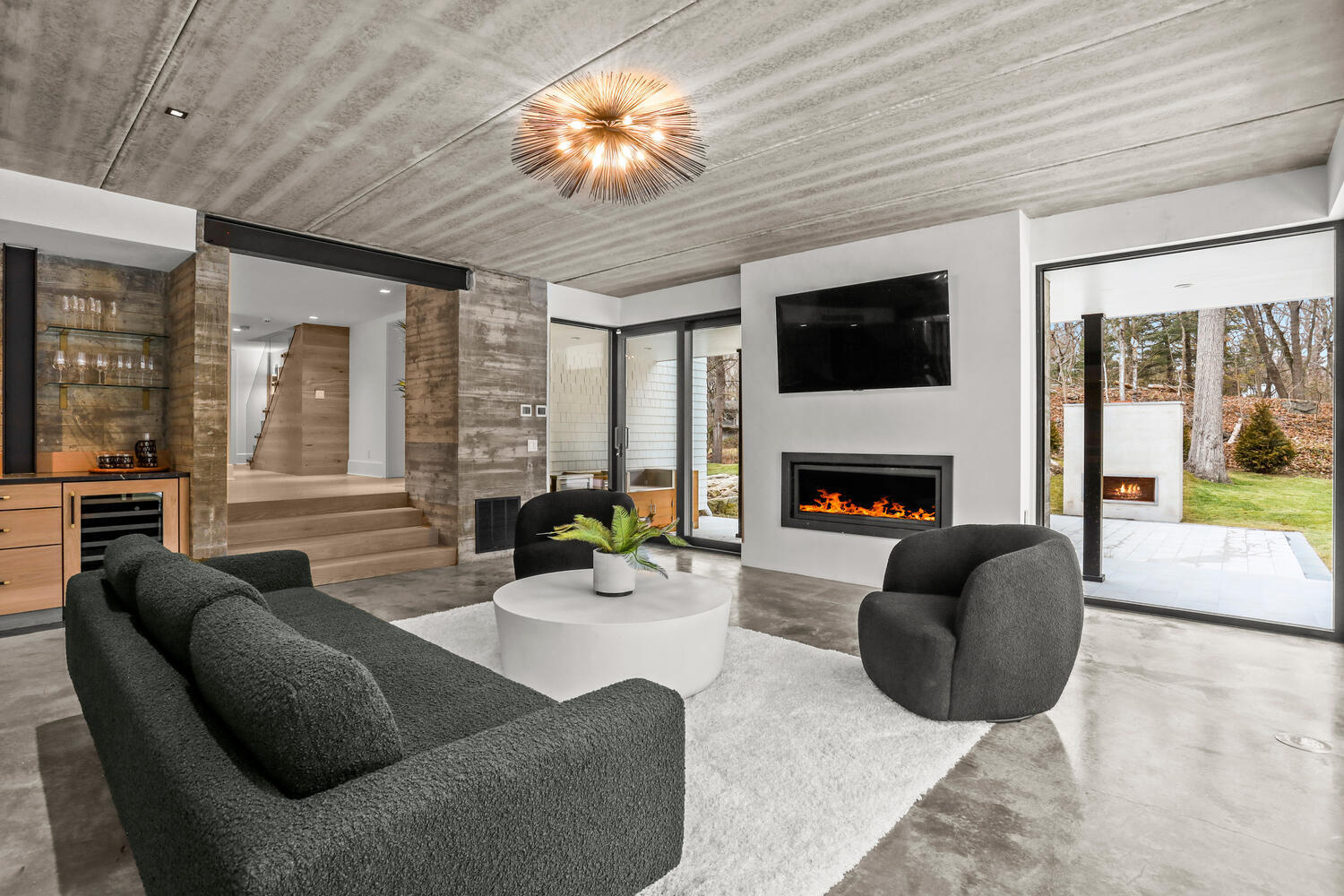 38 Goodwives River Road Darien, CT 06820 - Photo 8 of 58 a living room with furniture a fireplace and a flat screen tv