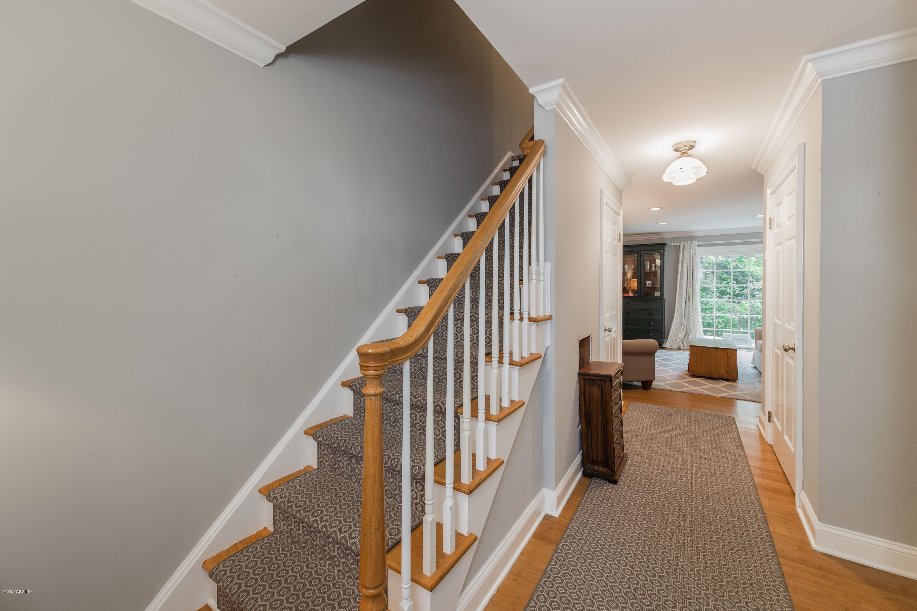 33 Talbot Lane, Unit 20 Greenwich, CT 06830 - Photo 3 of 20 a view of entryway and hall with wooden floor