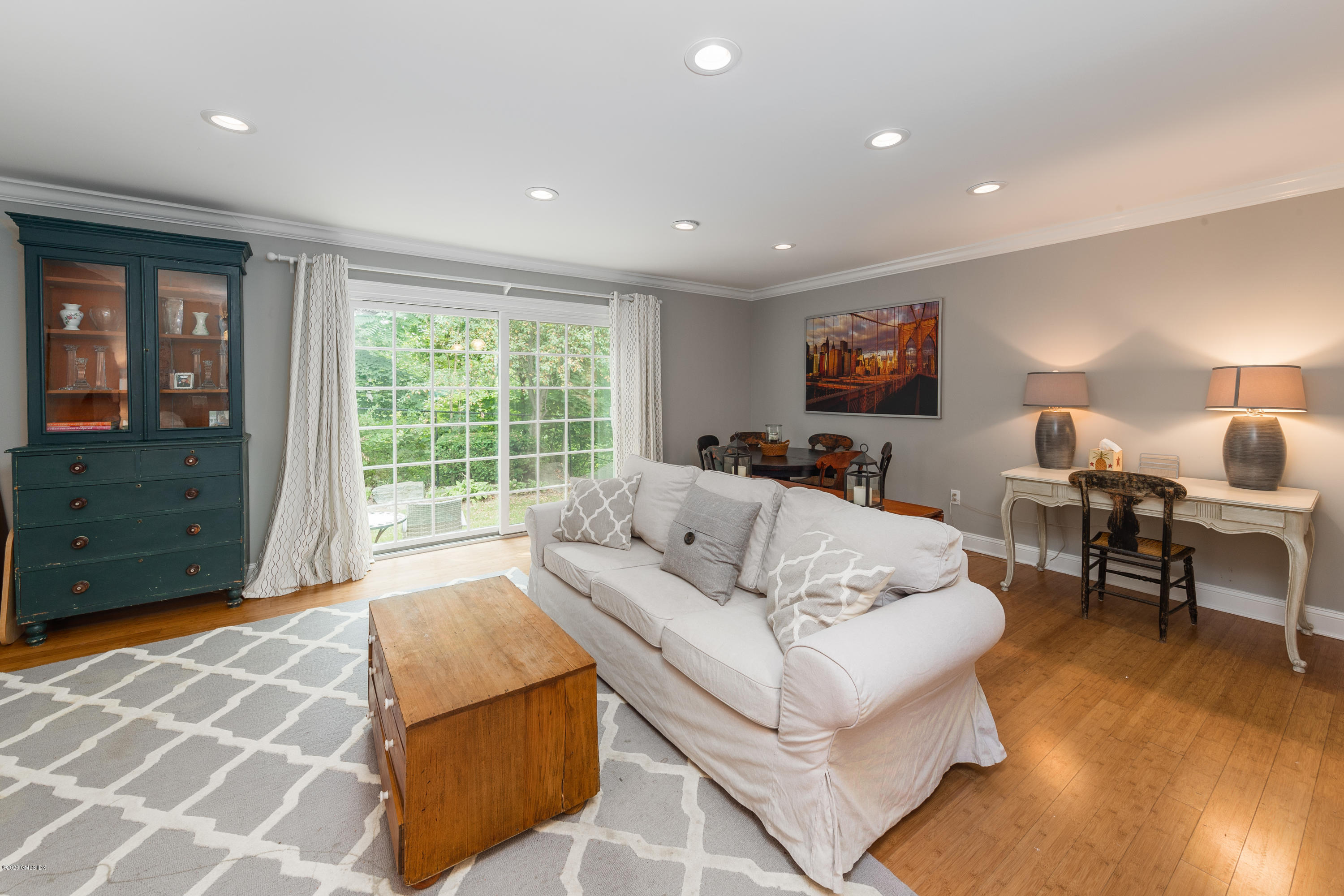 33 Talbot Lane, Unit 20 Greenwich, CT 06830 - Photo 4 of 20 a living room with furniture and a flat screen tv