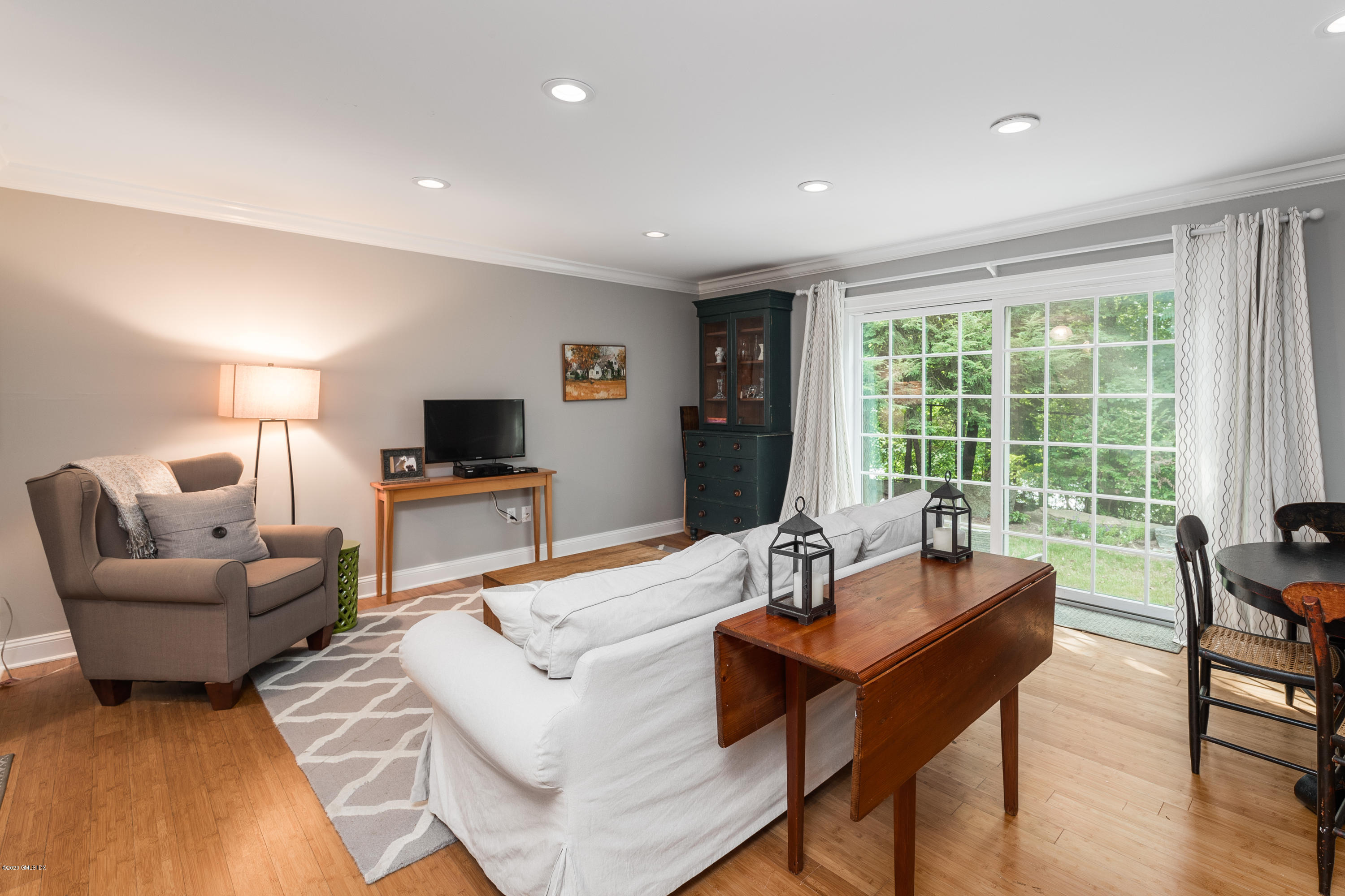 33 Talbot Lane, Unit 20 Greenwich, CT 06830 - Photo 5 of 20 a living room with furniture and a large window