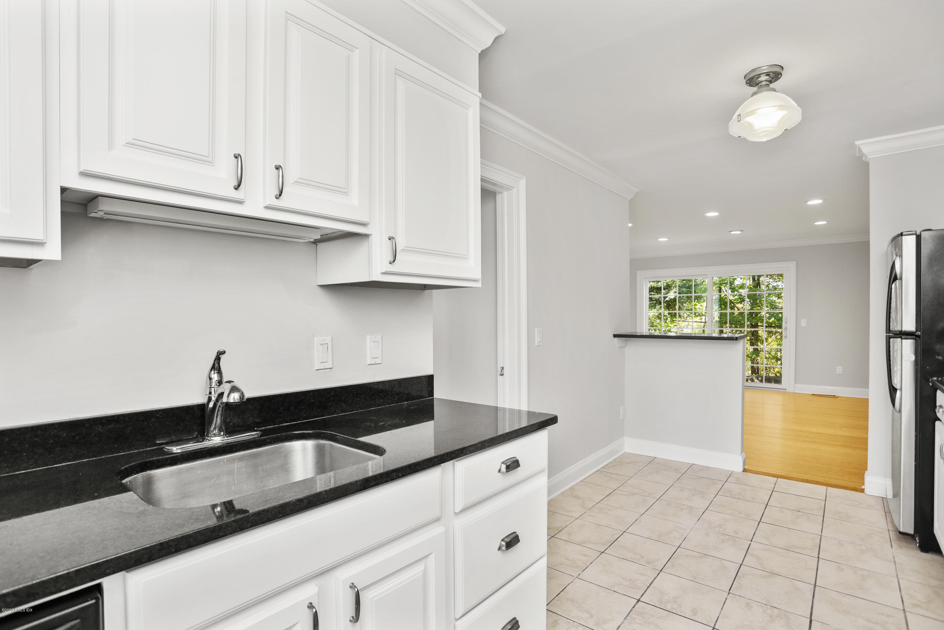 33 Talbot Lane, Unit 20 Greenwich, CT 06830 - Photo 8 of 20 a kitchen with granite countertop a sink and a stove