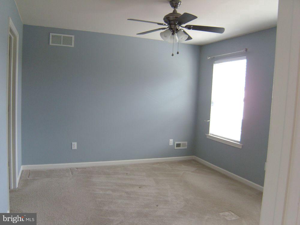 3784 William Daves Road, Unit 12 Doylestown, PA 18902 - Photo 14 of 19 a view of an empty room with a window