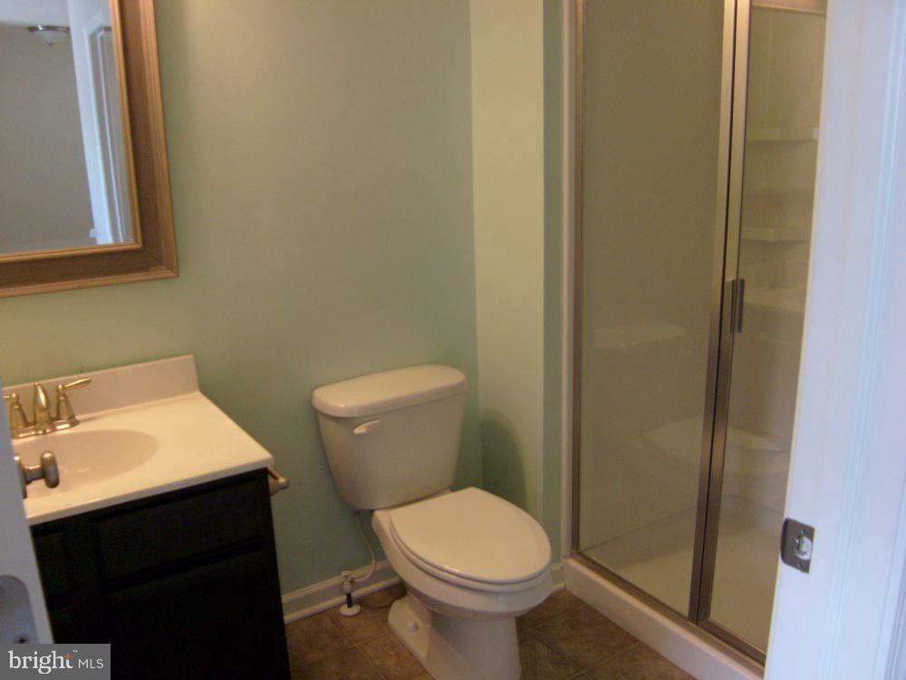 3784 William Daves Road, Unit 12 Doylestown, PA 18902 - Photo 19 of 19 a bathroom with a sink and a toilet