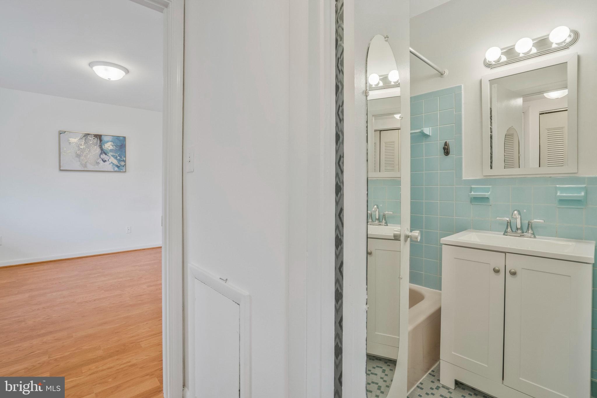 2754 Hollywood Road, Unit 301 Falls Church, VA 22043 - Photo 15 of 35 a bathroom with a sink a toilet and shower